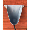 Front shot of waterless urinal installed on shed wall