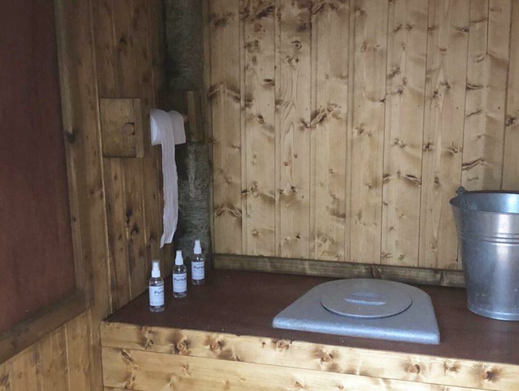 Interior of compost toilet at Finnebrogue Woods. Featuring a WooWoo GT batch composting toilet