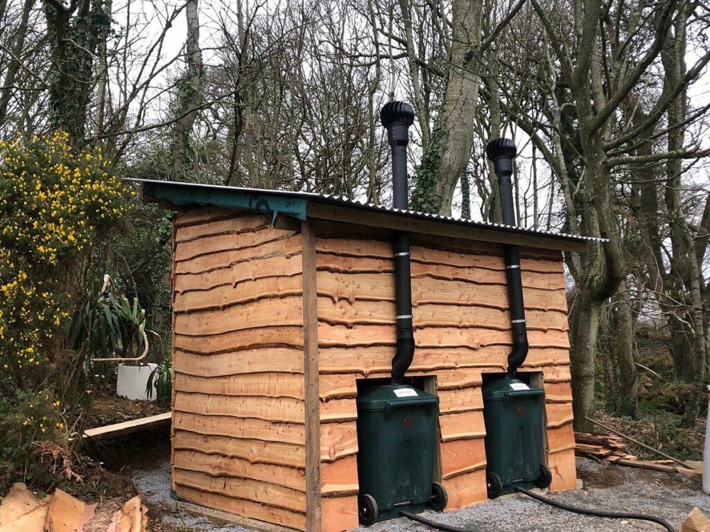 Rear of compost toilet at Finnebrogue Woods. Featuring a WooWoo GT batch composting toilet