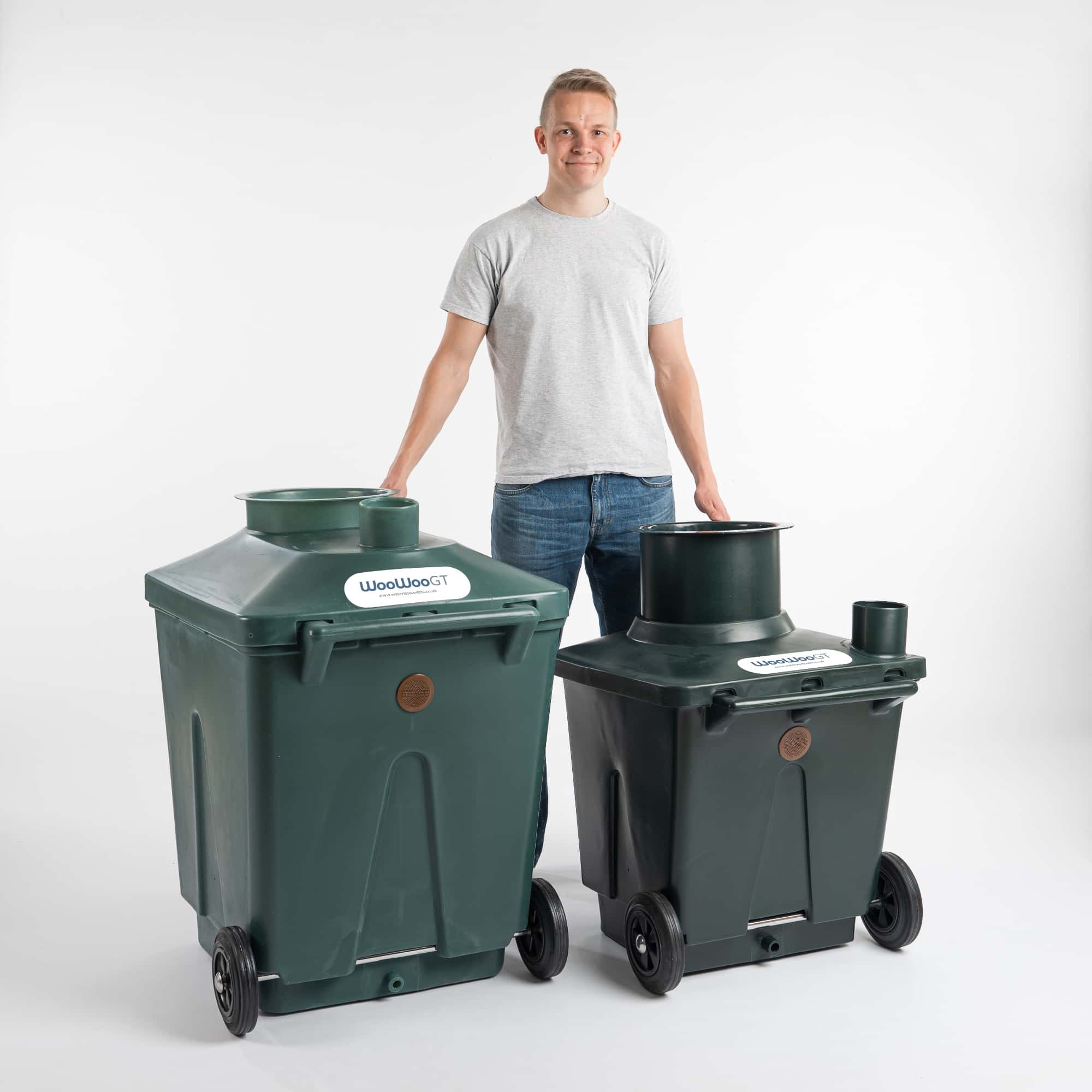 Adult male standing between the WooWoo GT composting toilet containers