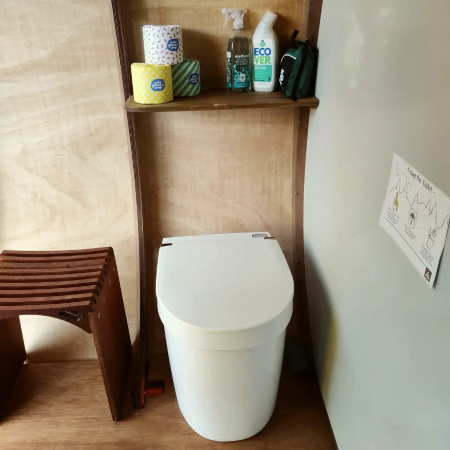 Separett Tiny toilet inside the shower unit at Strawberry Lane Tree Tents site.